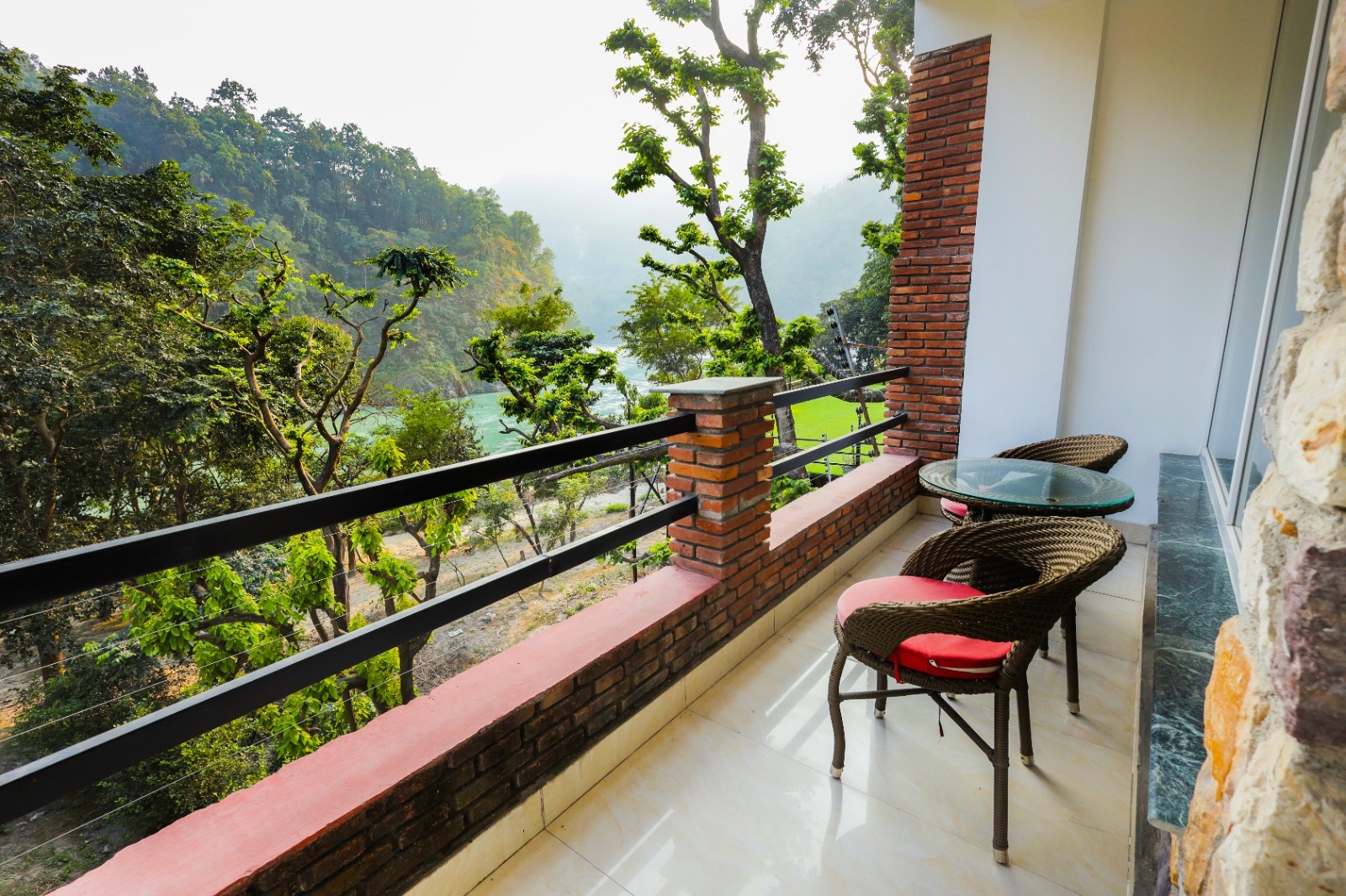 Private balcony looking over the Ganga and forest hills