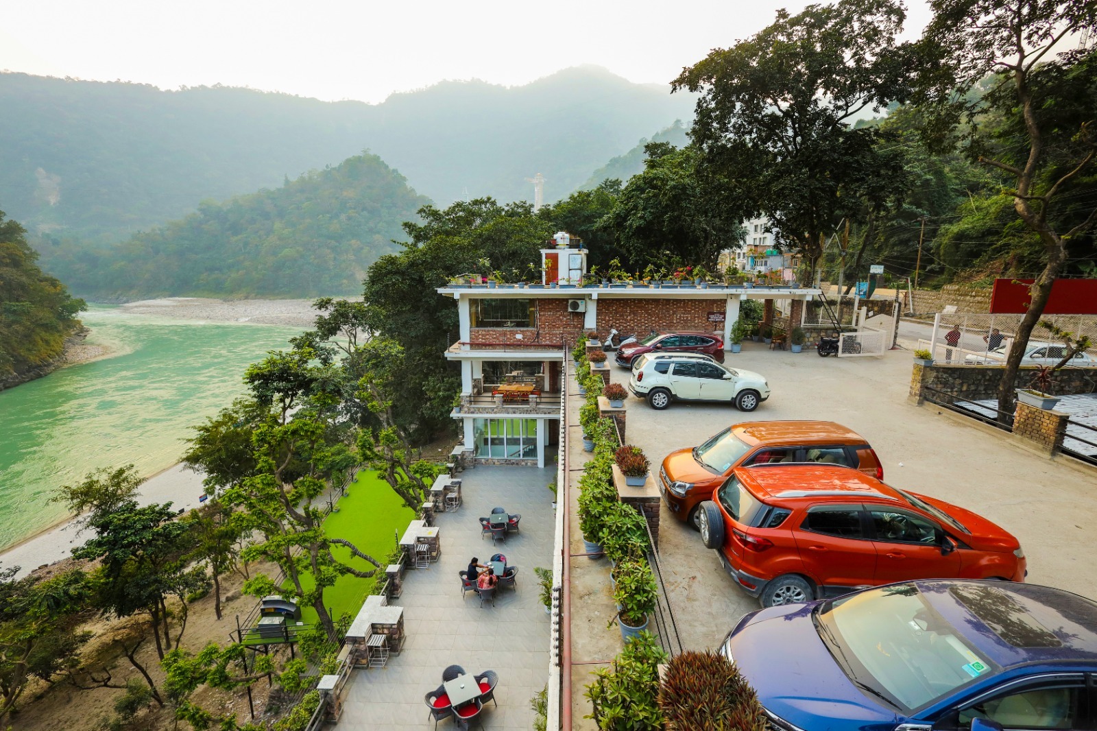 4-star riverside resort in Rishikesh seen from above, beside the green Ganga